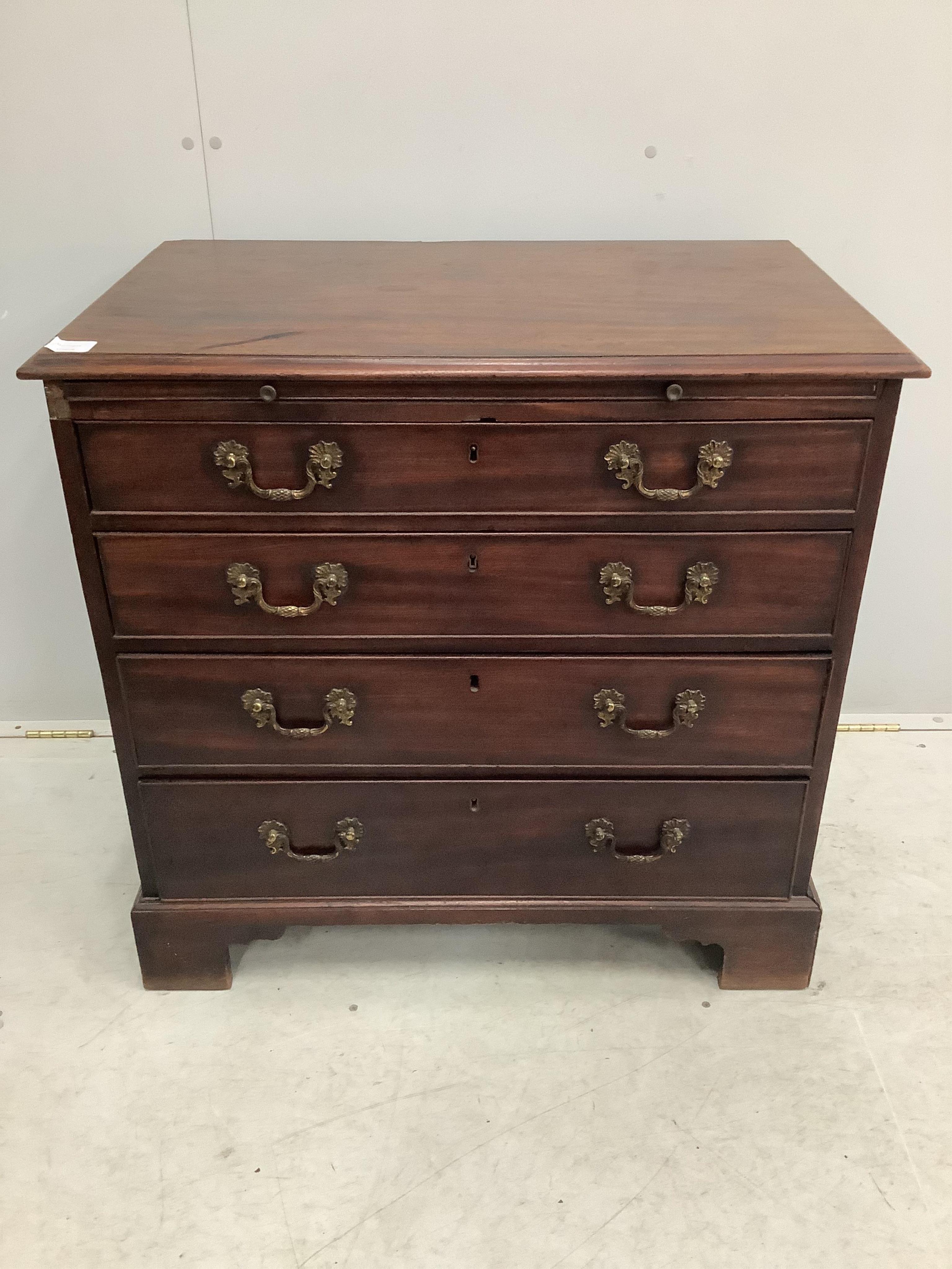 A George III mahogany chest with brushing slide, width 83cm, depth 51cm, height 81cm. Condition - fair